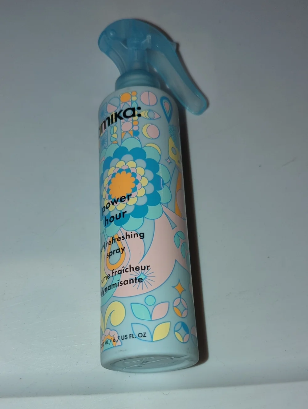 amika Refreshing Hair Spray in Light Blue and Pastel Peach